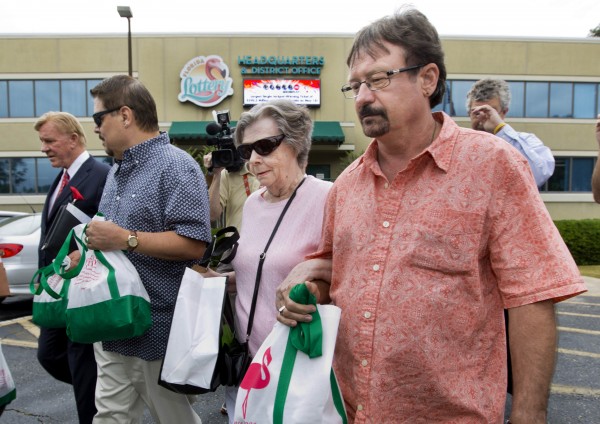 Gloria C. Mackenzie, an 84-year-old woman from Zephyrhills, Florida (center) and her son Scott (right) leave the Florida Lottery offices after claiming the largest single jackpot in American lottery history, valued at $590 million, in Tallahassee, June 5, 2013. Gloria C. Mackenzie, an 84-year-old woman from Zephyrhills, Florida (center) and her son Scott (right) leave the Florida Lottery offices after claiming the largest single jackpot in American lottery history, valued at $590 million, in Tallahassee, June 5, 2013.