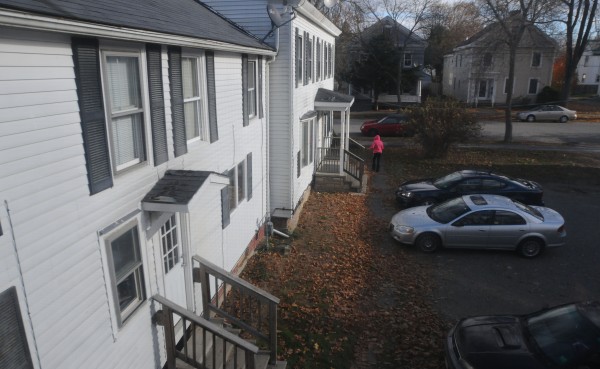 A neighbor walks out of her apartment at 166A Essex St. in Bangor to get her mail the morning after her neighbor Zackery Mailloux was arrested and charged with killing a woman at his apartment. Mailloux's blue sedan still sits in the driveway. A neighbor walks out of her apartment at 166A Essex St. in Bangor to get her mail the morning after her neighbor Zackery Mailloux was arrested and charged with killing a woman at his apartment. Mailloux's blue sedan still sits in the driveway.