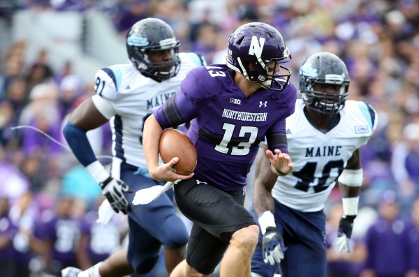Northwestern quarterback Trevor Siemian (13) is pursued by Maine’s Jonathan Lewis (91) and linebacker Christophe Mulumba (40) during their game on Sept. 21 in Evanston, Ill. Northwestern quarterback Trevor Siemian (13) is pursued by Maine’s Jonathan Lewis (91) and linebacker Christophe Mulumba (40) during their game on Sept. 21 in Evanston, Ill.
