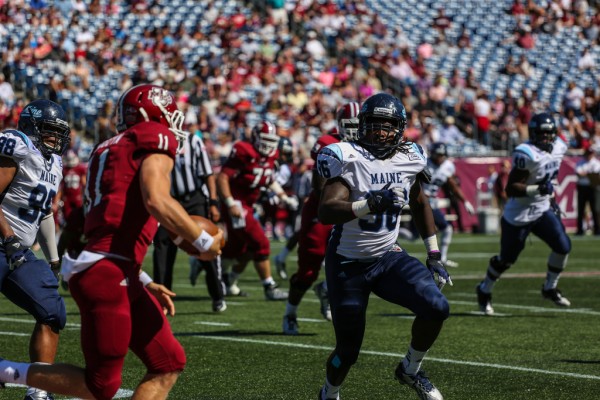 Senior defensive end Erwin Roach of the University of Maine (right) chases down University of Massachusetts quarterback Mike Wegzyn during their Sept. 7 game at Gillette Stadium in Foxborough, Mass. Senior defensive end Erwin Roach of the University of Maine (right) chases down University of Massachusetts quarterback Mike Wegzyn during their Sept. 7 game at Gillette Stadium in Foxborough, Mass.