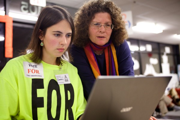 SOUTH PORTLAND, MAINE -- 11/05/13 -- Emmie Theberge of Protect South Portland (left) and Judy Berk of the Natural Resources Council of Maine look at their laptop as the election unfolded Tuesday night in South Portland. Troy R. Bennett | BDN SOUTH PORTLAND, MAINE -- 11/05/13 -- Emmie Theberge of Protect South Portland (left) and Judy Berk of the Natural Resources Council of Maine look at their laptop as the election unfolded Tuesday night in South Portland. Troy R. Bennett | BDN