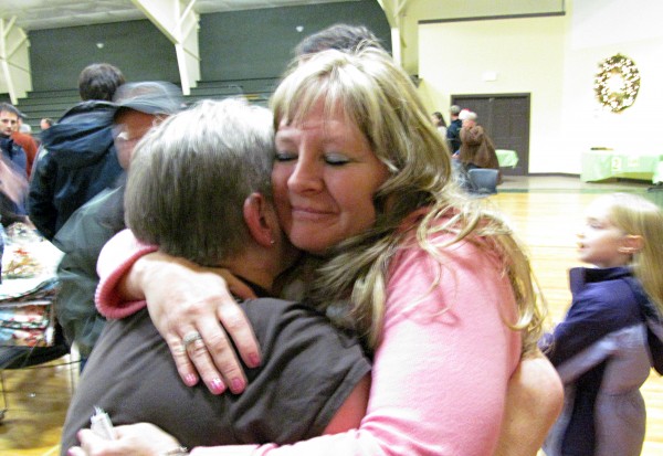 Joline Scovil, grandmother of a 3-year-old girl who was shot in the neck at her Bangor residence on Oct. 30, gets hugged by a well-wisher at a dinner held to raise money for the girl's family at Calvary Chapel Church's dining hall in Orrington on Saturday. Joline Scovil, grandmother of a 3-year-old girl who was shot in the neck at her Bangor residence on Oct. 30, gets hugged by a well-wisher at a dinner held to raise money for the girl's family at Calvary Chapel Church's dining hall in Orrington on Saturday.