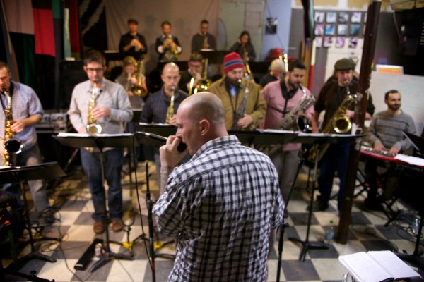 Rapper Bryan Eldridge, better known as Syn the Shaman, rehearses with the Fogcutters Big Band in Portland last week. Eldridge, and five other local performers, are appearing with the 19-piece band Dec. 6 at the State Theatre for the group's annual "Big Band Syndrome" show. Rapper Bryan Eldridge, better known as Syn the Shaman, rehearses with the Fogcutters Big Band in Portland last week. Eldridge, and five other local performers, are appearing with the 19-piece band Dec. 6 at the State Theatre for the group's annual "Big Band Syndrome" show.