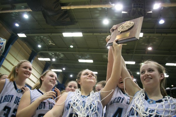 The Calais girls basketball team celebrates after winning the Eastern Maine Class C title at the Bangor Auditorium on Saturday, February 23, 2013. The Calais girls basketball team celebrates after winning the Eastern Maine Class C title at the Bangor Auditorium on Saturday, February 23, 2013.