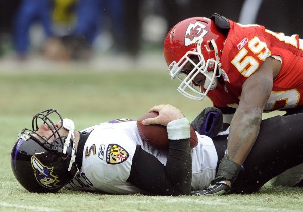 Baltimore Ravens quarterback Joe Flacco, left, lies on the turf after being sacked by Kansas City Chiefs linebacker Jovan Belcher during the first half of their AFC Wild Card NFL playoff football gamein this Jan. 9, 2011 file photo. Baltimore Ravens quarterback Joe Flacco, left, lies on the turf after being sacked by Kansas City Chiefs linebacker Jovan Belcher during the first half of their AFC Wild Card NFL playoff football gamein this Jan. 9, 2011 file photo.