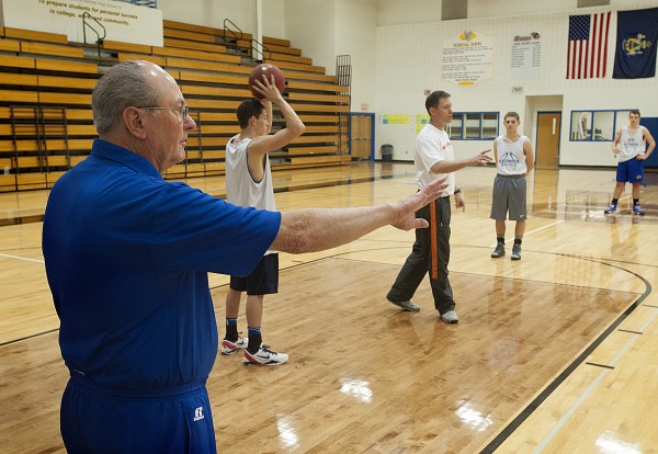 Former Bangor High School boys basketball coach Roger Reed, left, works with his son Mark Reed, right, who is coach of the Hermon High boys basketball team, during practice at Hermon Thursday, Dec. 5, 2013. Former Bangor High School boys basketball coach Roger Reed, left, works with his son Mark Reed, right, who is coach of the Hermon High boys basketball team, during practice at Hermon Thursday, Dec. 5, 2013.