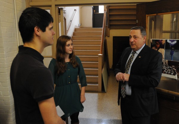 Governor Paul LePage chats with John Bapst seniors Noah Potvin and Jane Branch while on a tour of the school before giving a presentation on domestic violence to a packed auditorium on Friday. Governor Paul LePage chats with John Bapst seniors Noah Potvin and Jane Branch while on a tour of the school before giving a presentation on domestic violence to a packed auditorium on Friday.