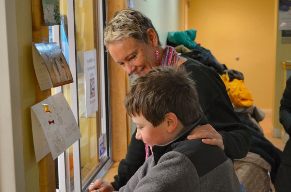 Waterville Mayor Karen Heck greets Evan Vigue, 9, of Waterville after he donates $65.43 he raised with his two friends Owen Harris, 10, and Carson Harris, 5, both of Waterville, to the Mid-Maine Homeless Shelter on Monday. Waterville Mayor Karen Heck greets Evan Vigue, 9, of Waterville after he donates $65.43 he raised with his two friends Owen Harris, 10, and Carson Harris, 5, both of Waterville, to the Mid-Maine Homeless Shelter on Monday.