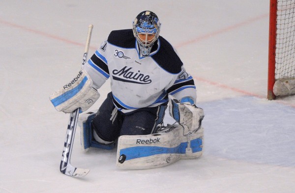 University of Maine goalie Martin Ouellette makes a save against American International in Orono recently. University of Maine goalie Martin Ouellette makes a save against American International in Orono recently.