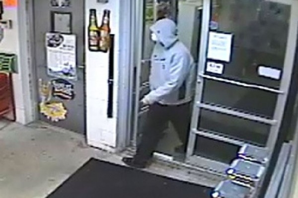 Portland police are distributing this surveillance camera footage of a man they say brought a rifle into a liquor store, announced that his weapon was loaded and then fled. Portland police are distributing this surveillance camera footage of a man they say brought a rifle into a liquor store, announced that his weapon was loaded and then fled.