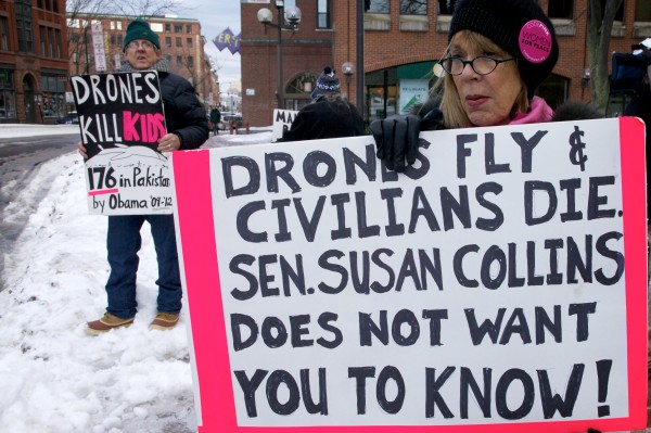 Mark Roman and Pat Taub, protesters with Code Pink, demonstrate outside U.S. Sen. Susan Collins' office in Portland on Monday. Mark Roman and Pat Taub, protesters with Code Pink, demonstrate outside U.S. Sen. Susan Collins' office in Portland on Monday.