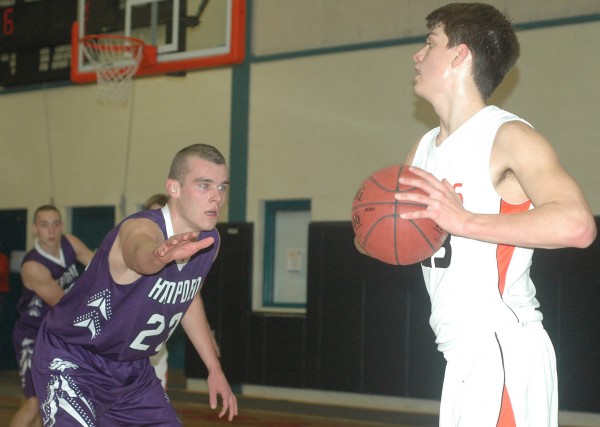 Hampden Academy's Zach Gilpin, left, guards Brunswick's Elliot Boyd during a KVAC boys high school basketball game at Brunswick on Friday. The Broncos won the clash of KVAC unbeatens with a 65-54 double overtime victory to improve to 3-0. Hampden Academy's Zach Gilpin, left, guards Brunswick's Elliot Boyd during a KVAC boys high school basketball game at Brunswick on Friday. The Broncos won the clash of KVAC unbeatens with a 65-54 double overtime victory to improve to 3-0.