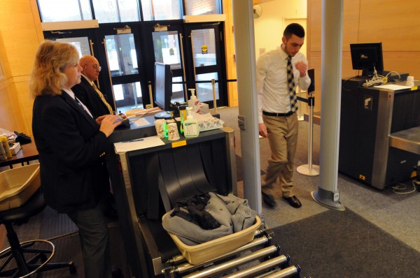 Maine State Judicial Marshals Kathy Beal and Tom Rowe scan a visitor to the Penobscot Judicial Center in Bangor on Monday. Maine State Judicial Marshals Kathy Beal and Tom Rowe scan a visitor to the Penobscot Judicial Center in Bangor on Monday.