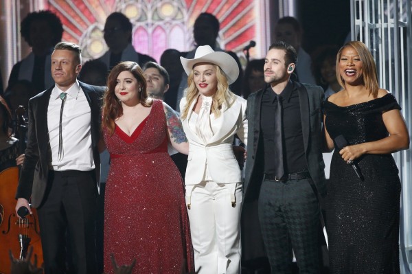 Macklemore, left, Mary Lambert, Madonna, Ryan Lewis and Queen Latifah stand together after performing "Same Love" at the 56th annual Grammy Awards in Los Angeles, California January 26, 2014. Macklemore, left, Mary Lambert, Madonna, Ryan Lewis and Queen Latifah stand together after performing "Same Love" at the 56th annual Grammy Awards in Los Angeles, California January 26, 2014.