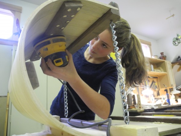 Abby Chamberlin, 15, of Camden, uses a power sander to meticulously smooth the toboggan she and three friends have been working on for six weeks. They will race in the upcoming 24th annual U.S. National Toboggan Championships at the Camden Snow Bowl. Abby Chamberlin, 15, of Camden, uses a power sander to meticulously smooth the toboggan she and three friends have been working on for six weeks. They will race in the upcoming 24th annual U.S. National Toboggan Championships at the Camden Snow Bowl.