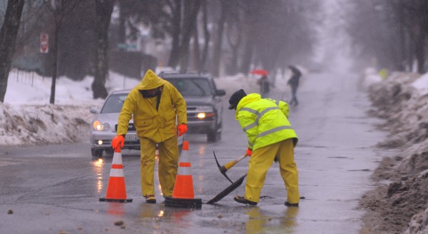 Bangor Public Works employees check storm drains along Center Street as heavy rain was falling in most of the state Monday morning. Bangor Public Works employees check storm drains along Center Street as heavy rain was falling in most of the state Monday morning.