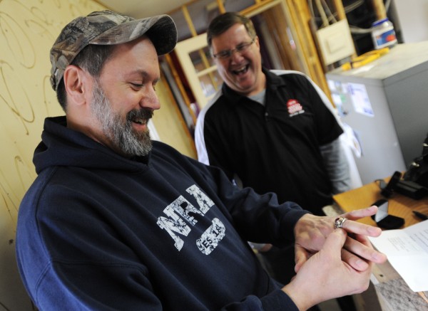 Ed Arey admires his class ring that he lost while working at the Red Barn Campground in Holden in 1985. "It still fits, forty pounds later." said Arey, drawing laughs from current campground owner Chris Waterhouse. Ed Arey admires his class ring that he lost while working at the Red Barn Campground in Holden in 1985. "It still fits, forty pounds later." said Arey, drawing laughs from current campground owner Chris Waterhouse.