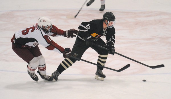 Bangor High School’s Justin Courtney (left) and Maranacook/Hall-Dale/Winthrop High School’s Dan Condon battle for the puck during a game last February in Bangor. Courtney has helped lead Bangor to a 5-1 start. Bangor High School’s Justin Courtney (left) and Maranacook/Hall-Dale/Winthrop High School’s Dan Condon battle for the puck during a game last February in Bangor. Courtney has helped lead Bangor to a 5-1 start.