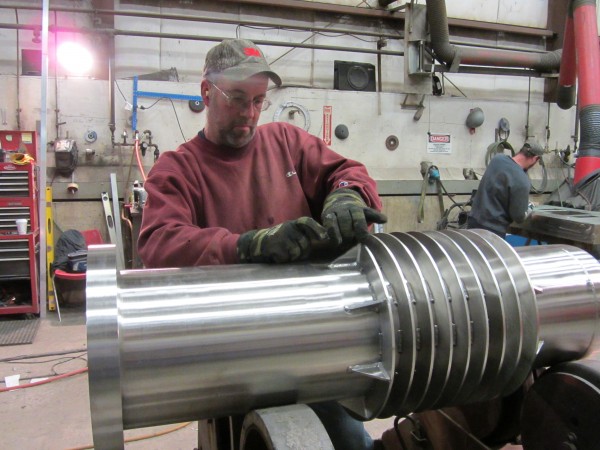 Chris Jarvis polishes a stainless steel filter that is manufactured at SteelPro in Rockland. Chris Jarvis polishes a stainless steel filter that is manufactured at SteelPro in Rockland.