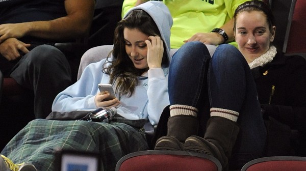Jessica Skillings (left), a member of the University of Maine field hockey team, views information on her phone during the UMaine-Vermont men's basketball game Thursday at the Cross Insurance Center in Bangor. Jessica Skillings (left), a member of the University of Maine field hockey team, views information on her phone during the UMaine-Vermont men's basketball game Thursday at the Cross Insurance Center in Bangor.
