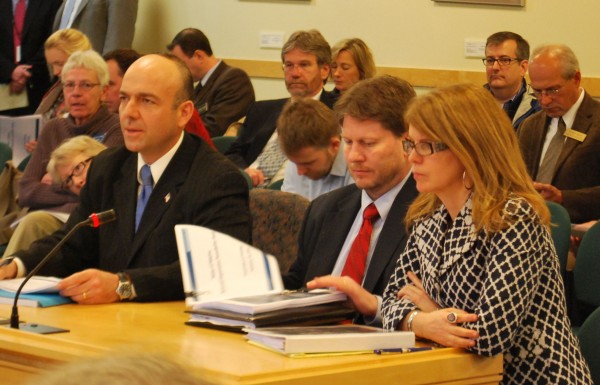 Gary Alexander (from left) and Eric Randolph of Rhode Island-based Alexander Group and Maine Department of Health and Human Services Commissioner Mary Mayhew prepare to answer questions from the Health and Human Services Committee in Augusta on Jan. 14. Gary Alexander (from left) and Eric Randolph of Rhode Island-based Alexander Group and Maine Department of Health and Human Services Commissioner Mary Mayhew prepare to answer questions from the Health and Human Services Committee in Augusta on Jan. 14.