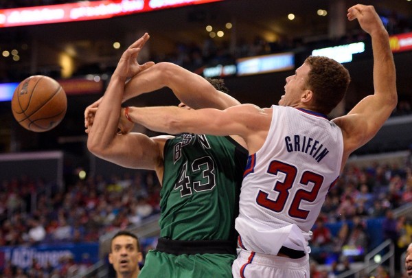 Los Angeles Clippers power forward Blake Griffin (32) fouls Boston Celtics power forward Kris Humphries (43) while battling for a rebound during second half action at Staples Center in Los Angeles Wednesday night. Los Angeles Clippers power forward Blake Griffin (32) fouls Boston Celtics power forward Kris Humphries (43) while battling for a rebound during second half action at Staples Center in Los Angeles Wednesday night.