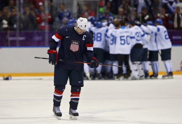 Team USA's Zach Parise skates away as Finland celebrates their win in their men's ice hockey bronze medal game at the Sochi 2014 Winter Olympic Games on Saturday. Team USA's Zach Parise skates away as Finland celebrates their win in their men's ice hockey bronze medal game at the Sochi 2014 Winter Olympic Games on Saturday.