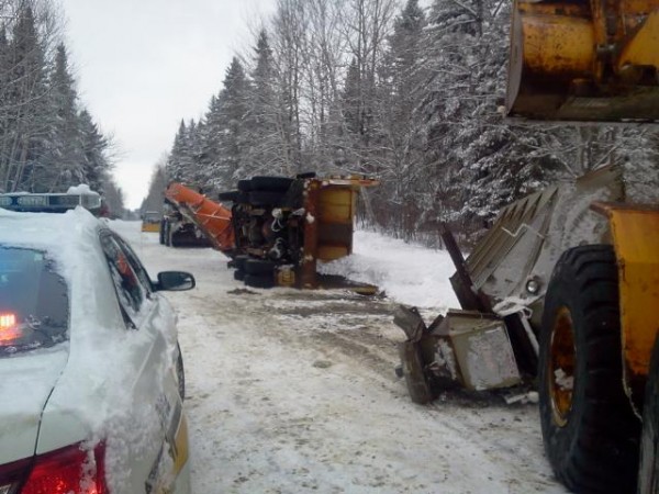 Grand Isle's only snowplow overturned after hitting a crevice in the road on Sunday. Grand Isle's only snowplow overturned after hitting a crevice in the road on Sunday.