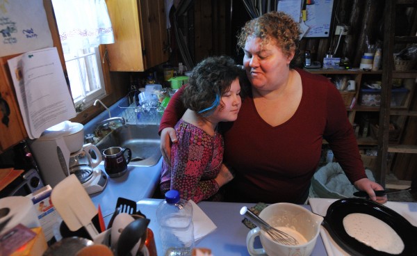 Liz Franck hugs her daughter Lucy Pearson while making pancakes for her on the morning of her 10th birthday at their Dedham home. Franck completed her undergraduate degree with help from the Parents as Scholars program and is now pursuing a master's degree in social work at the University of Maine. Liz Franck hugs her daughter Lucy Pearson while making pancakes for her on the morning of her 10th birthday at their Dedham home. Franck completed her undergraduate degree with help from the Parents as Scholars program and is now pursuing a master's degree in social work at the University of Maine.
