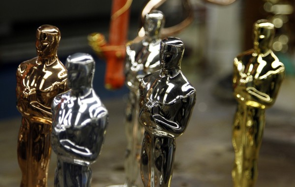 Oscar statuettes in the five steps of manufacturing, (from left to right) Copper, Britannia Pewter Base, Nickel, Silver and 24 Karat Gold, are seen during a media tour of the R.S. Owen and Company in Chicago in this February 2012 file photo. Oscar statuettes in the five steps of manufacturing, (from left to right) Copper, Britannia Pewter Base, Nickel, Silver and 24 Karat Gold, are seen during a media tour of the R.S. Owen and Company in Chicago in this February 2012 file photo.
