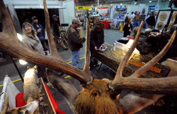 In this March 2009 file photo, people sample opening day attractions at the 71st annual Eastern Maine Sportsmen's Show at the University of Maine Field House in Orono. In this March 2009 file photo, people sample opening day attractions at the 71st annual Eastern Maine Sportsmen's Show at the University of Maine Field House in Orono.