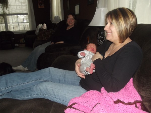 Christina Bridges holds her newborn daughter, Addison, who was delivered with telephone assistance from a Washington County emergency dispatcher. Beth Hawkins, Bridges' mother watches on. Christina Bridges holds her newborn daughter, Addison, who was delivered with telephone assistance from a Washington County emergency dispatcher. Beth Hawkins, Bridges' mother watches on.