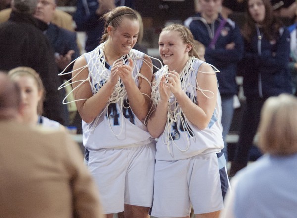Calais girls basketball players Paige Gillespie (44) and Taylorae Carter (34) are all smiles as they enjoy their victory over Orono in the Eastern Maine Class C championship at the Cross Insurance Center in Bangor on Saturday. Calais girls basketball players Paige Gillespie (44) and Taylorae Carter (34) are all smiles as they enjoy their victory over Orono in the Eastern Maine Class C championship at the Cross Insurance Center in Bangor on Saturday.
