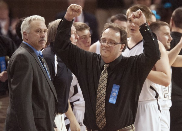 Lee Academy boys basketball coach Randy Harris (left) watches as Houlton boys basketball coach Robert Moran raises his hands in triumph as Houlton wins the Eastern Maine Class C championship at the Cross Insurance Center in Bangor on Saturday. Lee Academy boys basketball coach Randy Harris (left) watches as Houlton boys basketball coach Robert Moran raises his hands in triumph as Houlton wins the Eastern Maine Class C championship at the Cross Insurance Center in Bangor on Saturday.