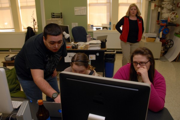 Mark Sullivan, a post-grad student at Northern Penobscot Tech, helps 18-year-old Brianna Davis of Millinocket and 18-year-old Sylvia Crocker of Lincoln with video editing in Leigh Thurlow's multimedia class on Tuesday. The class might soon be producing a video for the town of Lincoln. Mark Sullivan, a post-grad student at Northern Penobscot Tech, helps 18-year-old Brianna Davis of Millinocket and 18-year-old Sylvia Crocker of Lincoln with video editing in Leigh Thurlow's multimedia class on Tuesday. The class might soon be producing a video for the town of Lincoln.