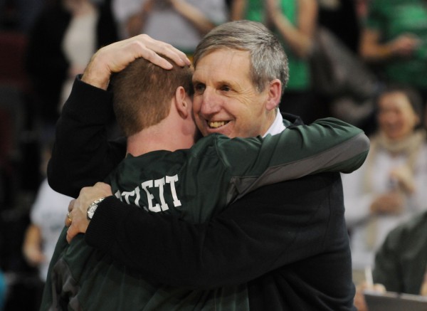 Old Town boys basketball coach Brian McDormand get s hug from center Zach Bartlett after Old Town defeated Poland 64-39 for the Class B state championship on Friday night at the Cross Insurance Center in Bangor. Old Town boys basketball coach Brian McDormand get s hug from center Zach Bartlett after Old Town defeated Poland 64-39 for the Class B state championship on Friday night at the Cross Insurance Center in Bangor.