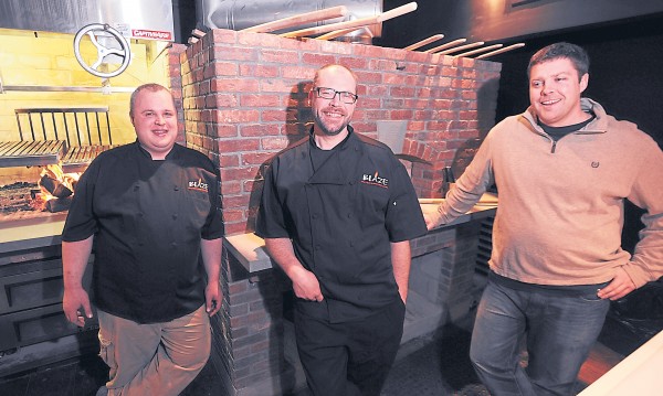 bdn photos by kevin bennett
Sous chef Duncan Gunn(left) , executive chef Josh Heikkeinen, and owner Matt Haskell share a laugh as they prepare to open Blaze, Bangor’s newest restaurant, on Jan. 14.
bdn photos by kevin bennett
Sous chef Duncan Gunn(left) , executive chef Josh Heikkeinen, and owner Matt Haskell share a laugh as they prepare to open Blaze, Bangor’s newest restaurant, on Jan. 14.