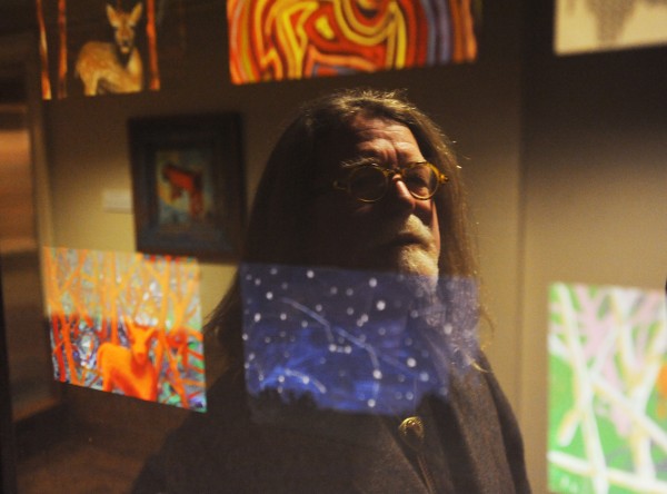 Artist Mathew Pierce O'Donnell is seen reflected in one of his pieces titled "Beyond Nature" as it hangs in the children's area of the Bangor Public Library on Monday. Pierce O'Donnell's art work will remain on display through the end of 2014. Artist Mathew Pierce O'Donnell is seen reflected in one of his pieces titled "Beyond Nature" as it hangs in the children's area of the Bangor Public Library on Monday. Pierce O'Donnell's art work will remain on display through the end of 2014.