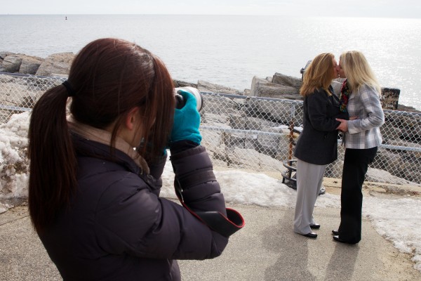 Photographer Tricia Jamiol captures a post wedding ceremony kiss between Kandis Stanley (right) and Jen Gibson at Portland Headlight in Cape Elizabeth on Monday. The pair traveled from New Orleans to get married in Maine. Photographer Tricia Jamiol captures a post wedding ceremony kiss between Kandis Stanley (right) and Jen Gibson at Portland Headlight in Cape Elizabeth on Monday. The pair traveled from New Orleans to get married in Maine.