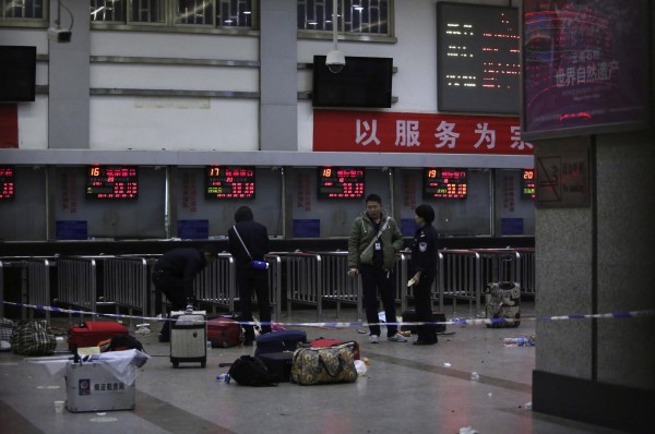 Police stand near luggages left at the ticket office after a group of armed men attacked people at Kunming railway station, Yunnan province, March 2, 2014, local time. At least 28 people have been killed in the violent attack at the train station in Kunming carried out by a group of unidentified people brandishing knives, the Chinese state news agency Xinhua said. Police stand near luggages left at the ticket office after a group of armed men attacked people at Kunming railway station, Yunnan province, March 2, 2014, local time. At least 28 people have been killed in the violent attack at the train station in Kunming carried out by a group of unidentified people brandishing knives, the Chinese state news agency Xinhua said.