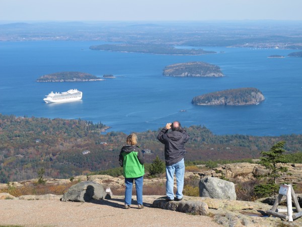 In this October 2013 file photo, two people stop to look out at Frenchman Bay near the top of Cadillac Mountain in Acadia National Park, two days after the park reopened following a 16-day shutdown of federal government. In this October 2013 file photo, two people stop to look out at Frenchman Bay near the top of Cadillac Mountain in Acadia National Park, two days after the park reopened following a 16-day shutdown of federal government.