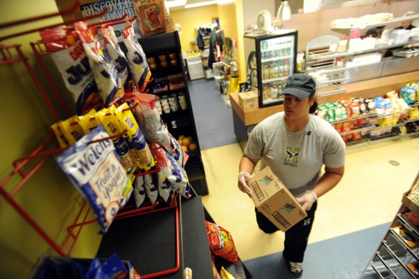 Husson softball player Chelsea Brennan stocks shelves at the Cressy Marketplace on the Husson University campus on Wednesday, April 9, 2014. Husson softball player Chelsea Brennan stocks shelves at the Cressy Marketplace on the Husson University campus on Wednesday, April 9, 2014.