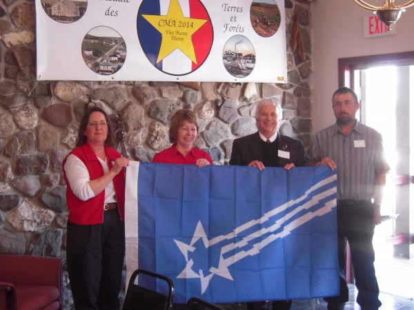 Town officials from Van Buren, Maine, and St. Leonard, N. B., (formerly the single town of Grande Rivier) present the flag of Grande Riviere to the mayors of Pohenegamook and St. Athanase, Quebec, in a ceremony April 9. From left, Nancy Troeger, acting town manager of Van Buren; Louise LaBonte, mayor of Pohenegamook; Carmel St. Amand, mayor of St. Leonard; and Andre St. Pierre, mayor of St. Athanase. Town officials from Van Buren, Maine, and St. Leonard, N. B., (formerly the single town of Grande Rivier) present the flag of Grande Riviere to the mayors of Pohenegamook and St. Athanase, Quebec, in a ceremony April 9. From left, Nancy Troeger, acting town manager of Van Buren; Louise LaBonte, mayor of Pohenegamook; Carmel St. Amand, mayor of St. Leonard; and Andre St. Pierre, mayor of St. Athanase.
