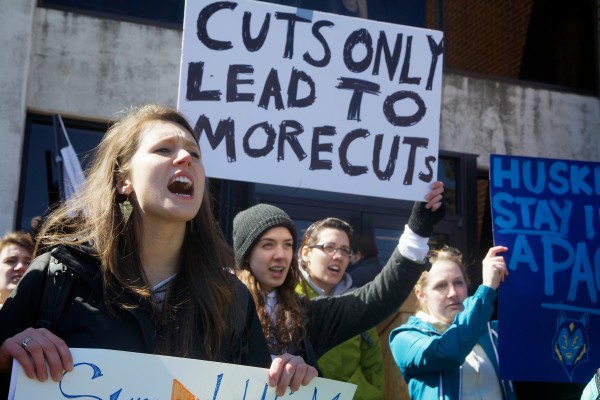 University of Southern Maine business and economics major Laine Geistwalker (left) protests deep cuts proposed by President Theo Kalikow on March 24 in Portland. University of Southern Maine business and economics major Laine Geistwalker (left) protests deep cuts proposed by President Theo Kalikow on March 24 in Portland.