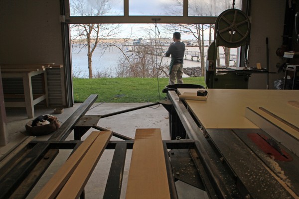 Woodworker Tom Weis speaks with a client in his shop on the lower floor of The Steel House while his dog, Clover, takes a nap nearby. Woodworker Tom Weis speaks with a client in his shop on the lower floor of The Steel House while his dog, Clover, takes a nap nearby.