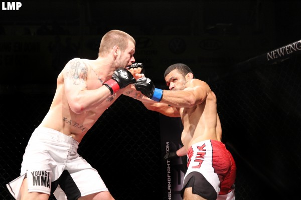 Ryan Sanders (left) of Brewer battles Gil de Freitas of Ludlow, Massachusetts, during a mixed martial arts title bout on the New England Fights XIII card Saturday night at the Androscoggin Bank Colisee. Ryan Sanders (left) of Brewer battles Gil de Freitas of Ludlow, Massachusetts, during a mixed martial arts title bout on the New England Fights XIII card Saturday night at the Androscoggin Bank Colisee.