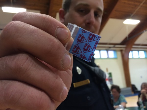 Old Town police Sgt. Lee Miller holds a small baggie that once held synthetic bath salts at a community-parent drug awareness forum held April 30, 2014 at Leonard Middle School. Old Town police Sgt. Lee Miller holds a small baggie that once held synthetic bath salts at a community-parent drug awareness forum held April 30, 2014 at Leonard Middle School.
