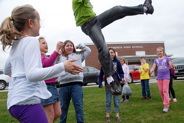 Opal Myrick Elementary School students toss 8-year-old Mason McDunnah in the air while playing in front of Schenck High School, where Opal Myrick has a wing for its elementary students. Opal Myrick received an A grade while Schenck received a C. Opal Myrick Elementary School students toss 8-year-old Mason McDunnah in the air while playing in front of Schenck High School, where Opal Myrick has a wing for its elementary students. Opal Myrick received an A grade while Schenck received a C.