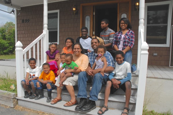 All 13 members of the Jerome and Joyce Jackson family take a moment to relax together on the porch of their new St. Francis home. The family was able to purchase the house thanks to a program through USDA Rural Development. All 13 members of the Jerome and Joyce Jackson family take a moment to relax together on the porch of their new St. Francis home. The family was able to purchase the house thanks to a program through USDA Rural Development.