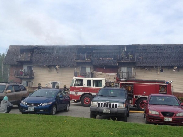 Firefighters battle a blaze at the Deerfield apartment complex on Ohio Street in Bangor on Monday morning. Firefighters battle a blaze at the Deerfield apartment complex on Ohio Street in Bangor on Monday morning.